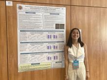 Isabel Coiduras standing next to her poster at the 2022 SSIB meeting